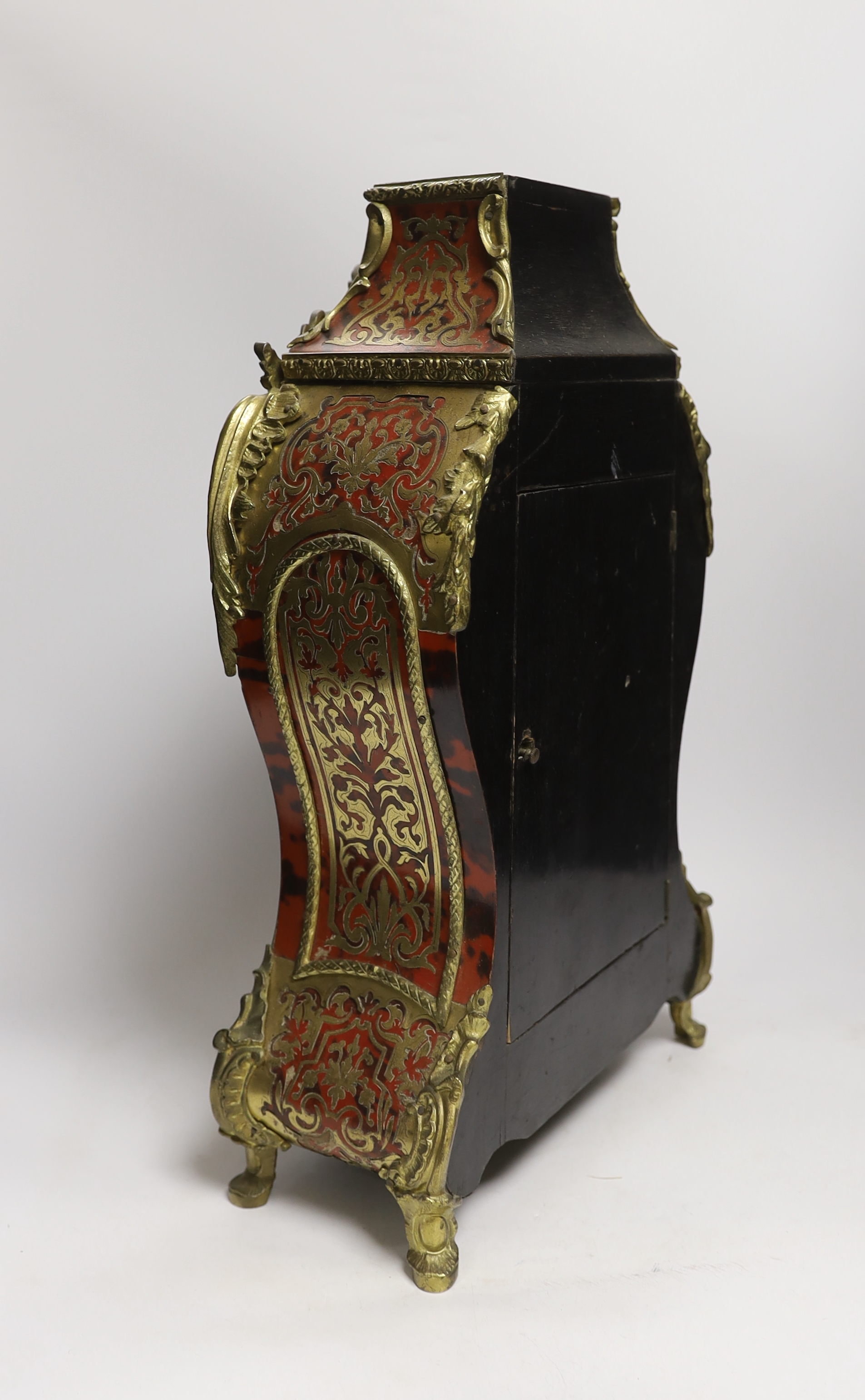 A 19th century Louis XV style red boulle eight day mantel clock